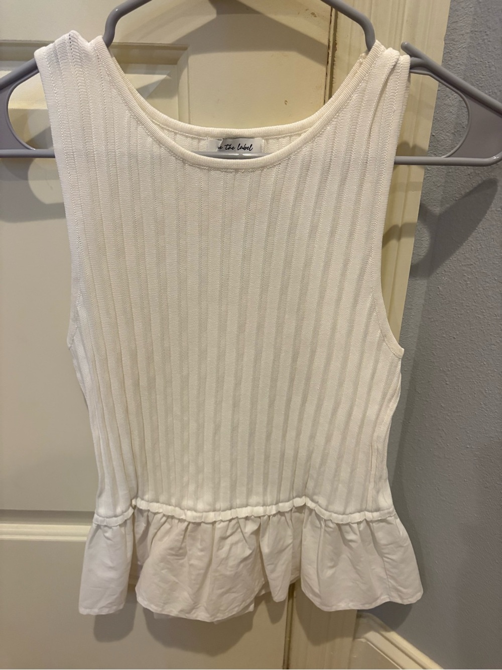 White Ribbed Sleeveless Peplum Top